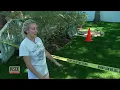 Woman Falls Into 8-Foot Sinkhole In Her Backyard