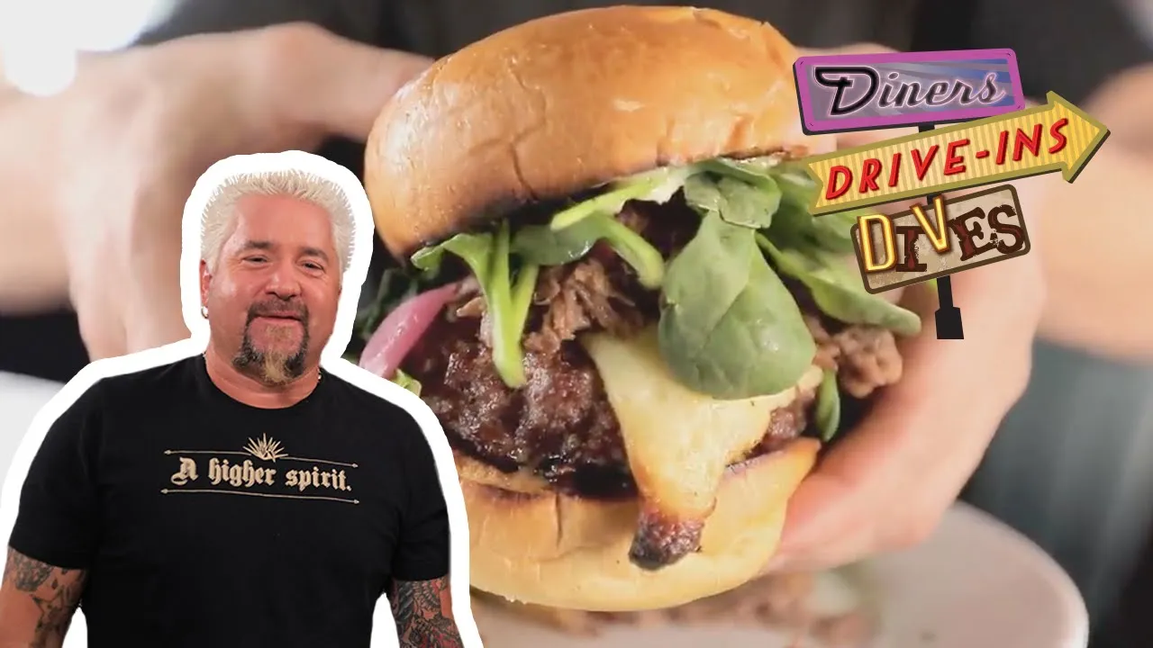 Guy Fieri Eats a Massive Lamb-Topped Burger   Diners, Drive-Ins and Dives   Food Network