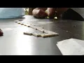 Male's Hands Playing Game of Dominoes