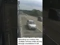 Speeding car crashes into multiple vehicles while driving through roundabout in UK