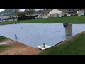 Harbor Freight 28x59 foot silver tarp covering Little League infield