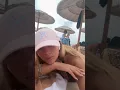 Sunbathing routine woman without a bra with big breasts