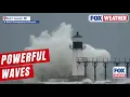 Waves Crash Onto Lake Michigan Lighthouse Amid Lake-effect Snow Storm