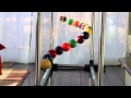 A simple demo of order and chaos and order again - Home made Pendulum Wave with 15 billiard balls