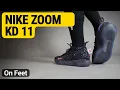 Nike Zoom KD 11 Black Bright Crimson Photo Blue on feet