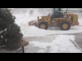 High winds form snow drifts that block streets in Wyoming