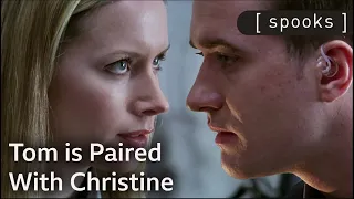tom is paired with cia agent christine spooks