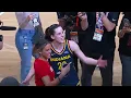 Caitlin Clark embraces Iowa teammate Gabbie Marshall after her home preseason debut WNBA on ESPN