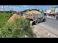 Download Lagu Dump Truck Unloaded of dirt filling up extended ring road and dozer pushing dirt