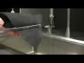 Charged Rods and a Stream of Water
