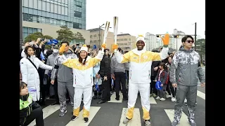 WTOP s Suann Lee carries Olympic torch
