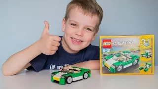 Kid playing with Lego Creator 31056 Green Car
