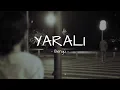 Öyle bir baktı yüzüme giderken yaralı yaralı (YARALI - BENGÜ) - Lyrics