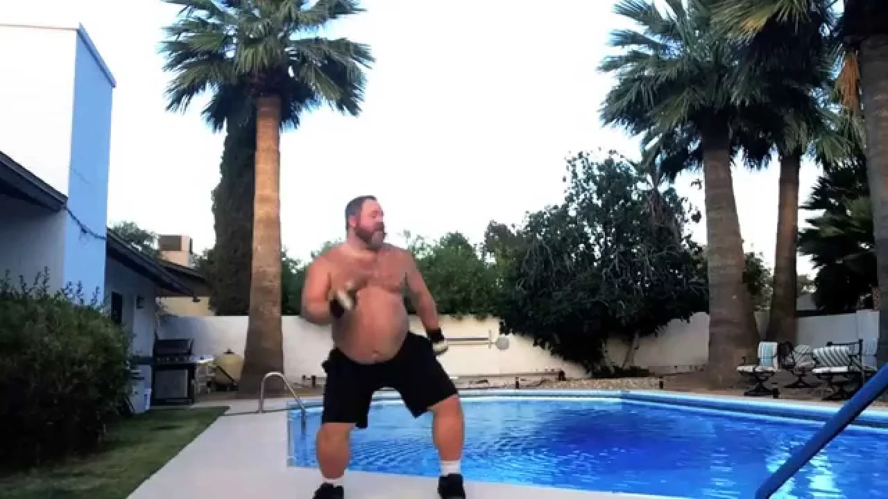 Shirtless Big Bear Happily Dancing poolside to The Boys' "Dial My Heart"