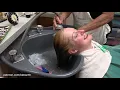 Having my hair shampooed and hair toned in a beauty salon