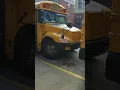 Cop Giving a Summons to a School Bus at a No-Standing Zone in Front of School