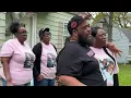 Flint parents call for Justice for Tyhari speaking in front of bullet-riddled home