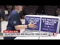Volunteers at the Thomas and Mack pack 160 meals for those in need