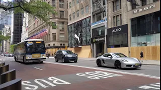 NYC SIM4C Staten Island Manhattan Express Bus a Porsche and boarded up windows on 5th Ave 1hinew