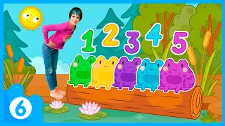 Maria tells five colorful frogs about numbers.