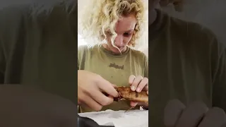 The adventurous one trying some local smoked fish 🐟 #sailingfamily #family #foodlover #kids #PNG