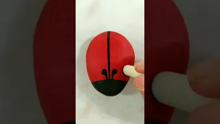 Ladybug acrylic painting on stone
