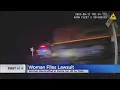 Woman injured while handcuffed in police car when struck by train sues departments officers