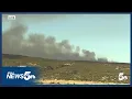 Fire burning along Highway 115 on Fort Carson grows with no containment Thursday afternoon