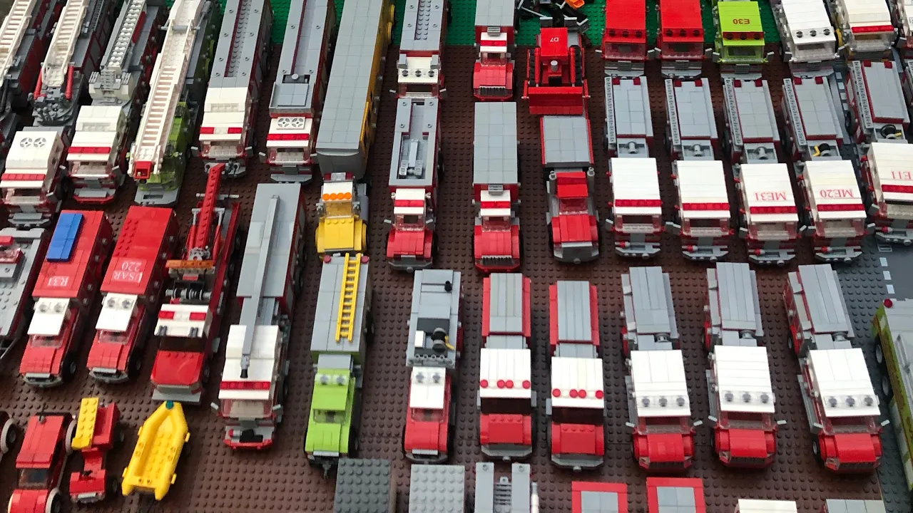 A fire truck comes out of the fire station. I have fun playing at the fire station play set