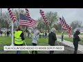 Community places American flags at Galesburg High ahead of deputy s memorial service