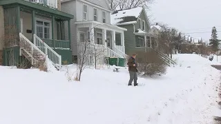 Duluth residents shovel through their second snowstorm of the week