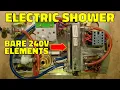 Lagu Inside a vintage electric shower with bare 240V elements in the water