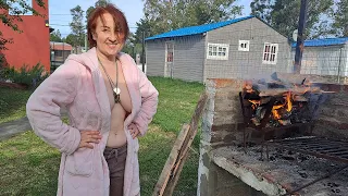 Sausages on the fire. Kitchen in Uruguay in a village. BBQ. Mila naturist.