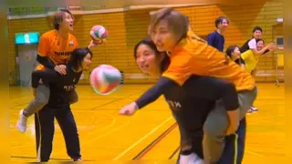 lift and carry 3 girls carrying their male partners in a volleyball match 