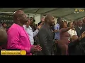 Bishop SB Zikhali preaching at GKC with Sindi Ntombela