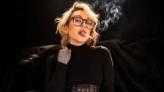 hot women smoking in black shirt and glasses