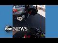 shows moment child falls from car