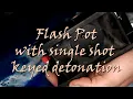 Flash pot with keyed detonation