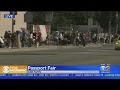 Hundreds Line Streets Outside Van Nuys Post Office For Passport Fair