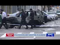 Man shot by police in Queens after car set on fire at NYPD precinct s