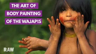 wajapi body painting with urucum seeds brazil