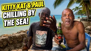 Kitty Kat and Paul having a drink at the seaside