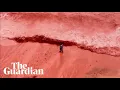 Lagu Beach in Iran turns red after rain