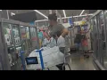 Lady With Water Jugs in Electronics at Firestone Walmart in South Gate CA