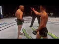 Nate Diaz points middle finger at Conor Mcgregor in the middle of a fight