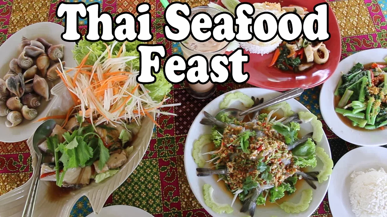 Thai Food Feast: Sea Snails, Raw Prawns & Fish at a Thai Restaurant. Eating Thai Food in Thailand