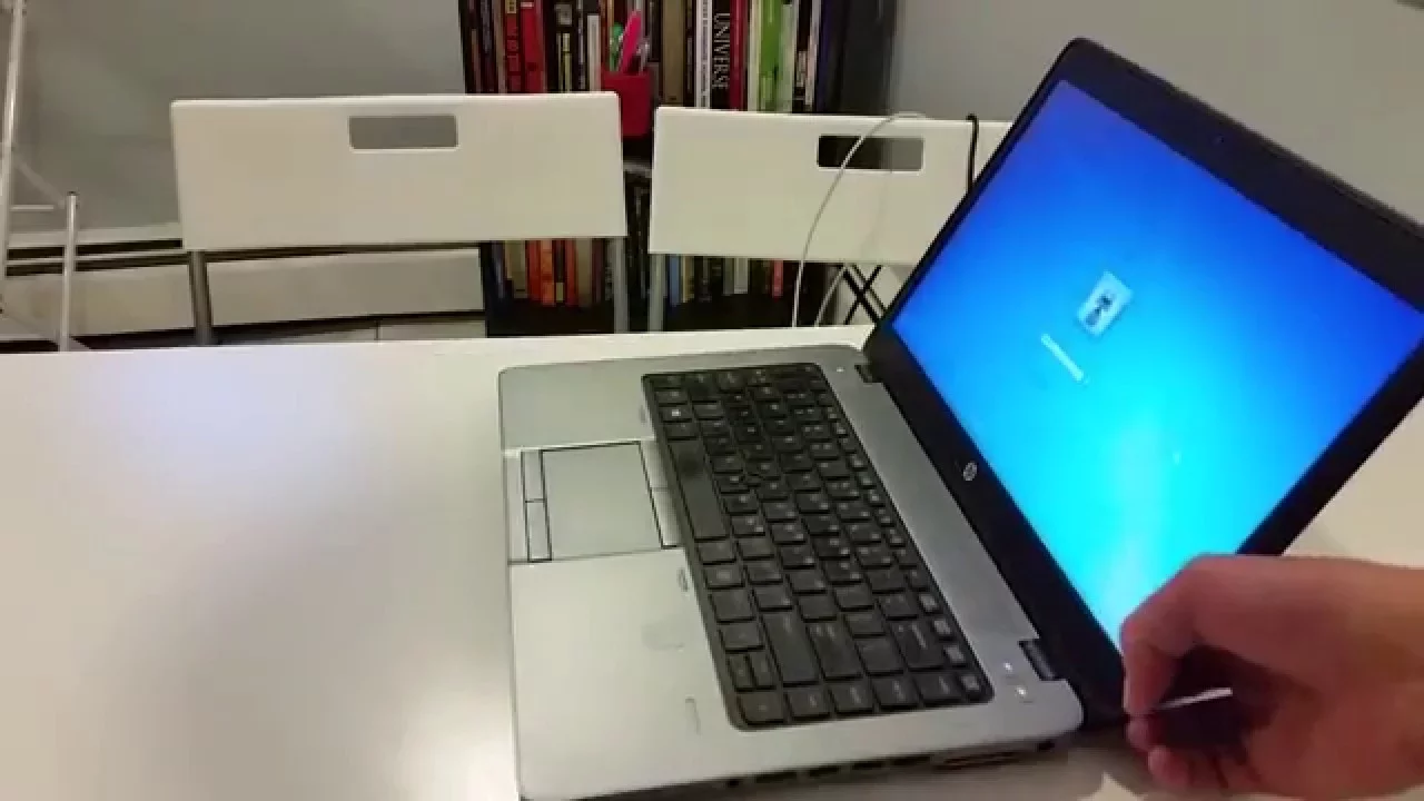 Disassembling HP Elitebook 840 G2 laptop. Removing the battery, SSD, Wireless card, keyboard, bottom. 