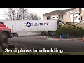 Tractor trailer crashes into NJ building off Route 3 driver rescued