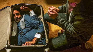 man stuck in suitcase produces gold coins when hurt