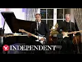 Secretary Antony Blinken plays guitar serenading State Department crowd